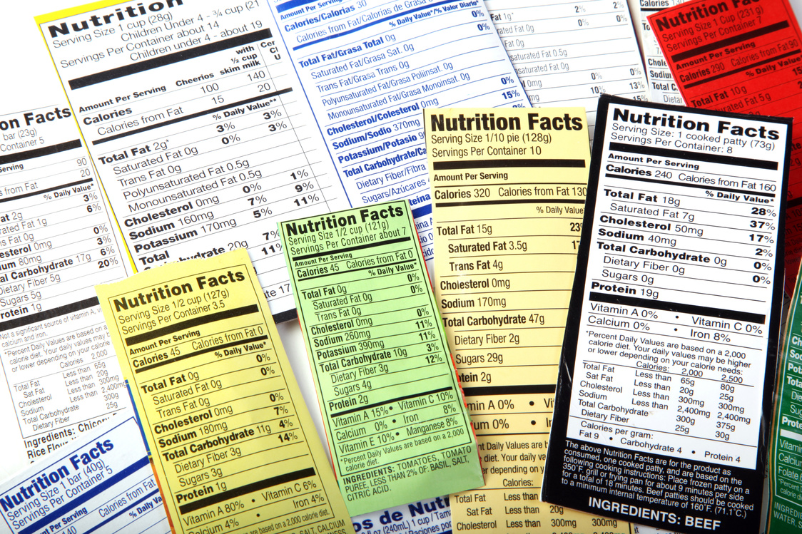 many different types of food labels are shown on a table, explaining Nutritional information.